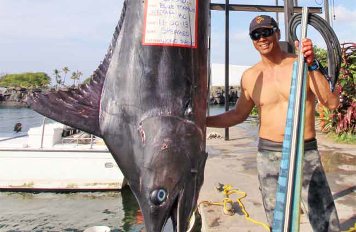 Wendall Ko weighing fish